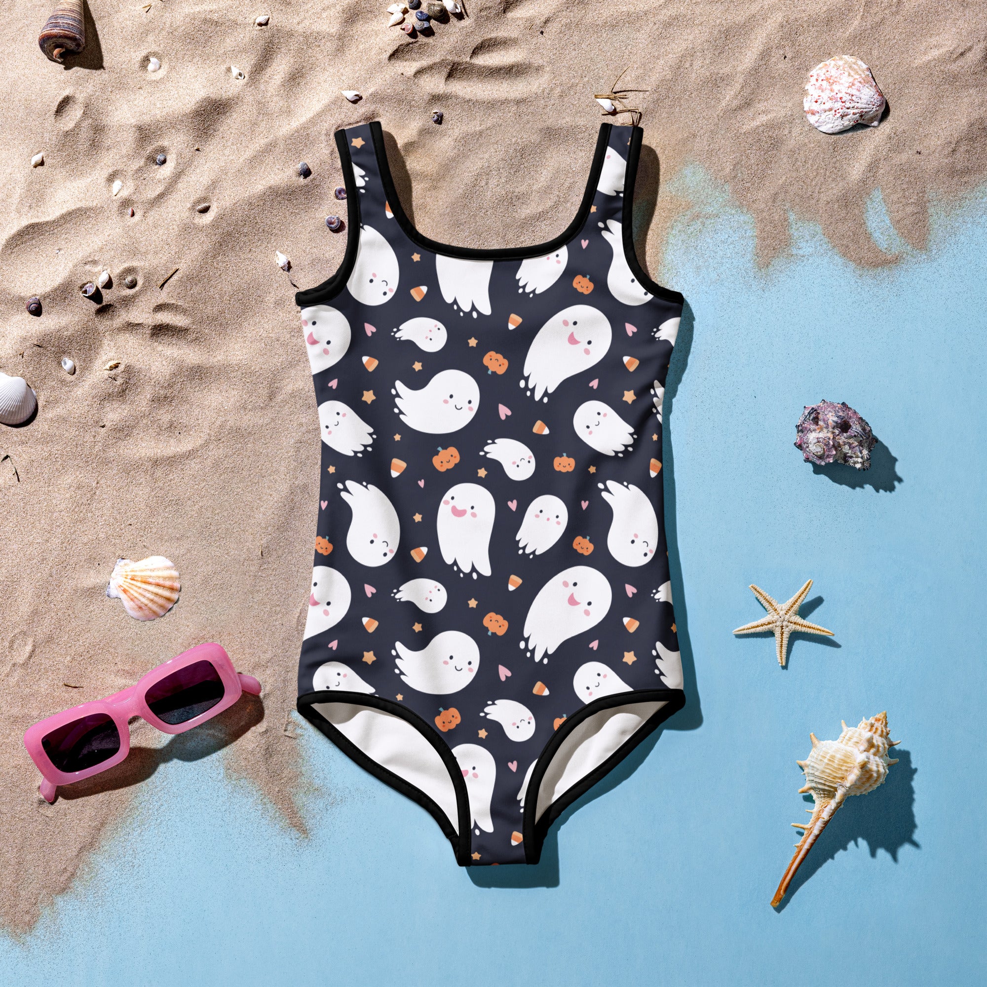 Black one-piece girls swimsuit with white ghosts orange pumpkins and pink hearts for halloween design
