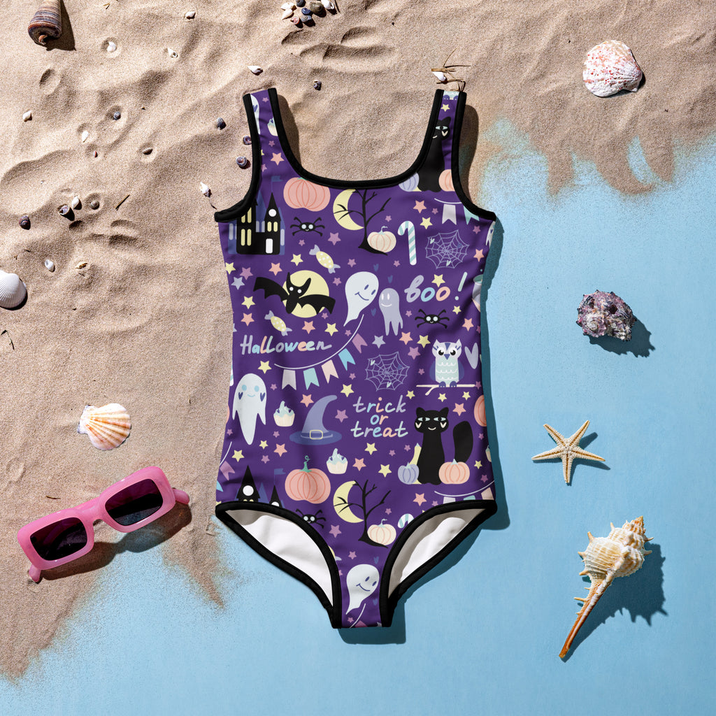 Girls spooky halloween buttery soft swimsuit in purple with black trim and ghost, bat, pumpkin, boo, and trick or treat designs