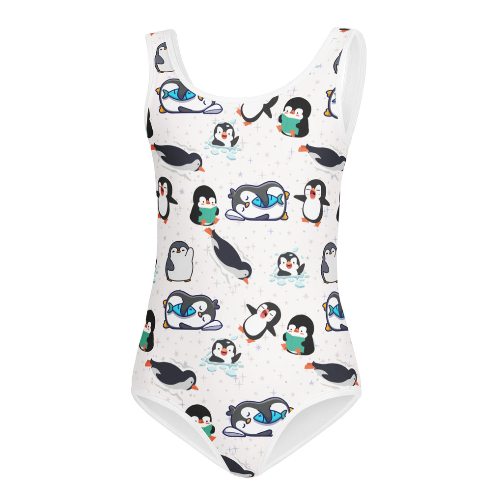 White one-piece swimsuit with playful cartoon penguin pattern in black white teal and orange for girls winter dance and gymnastics