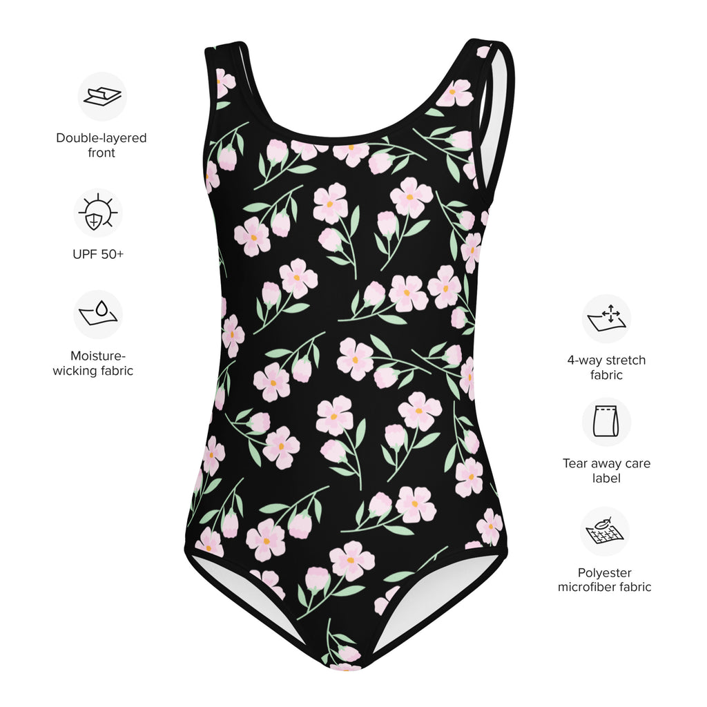 Black one-piece girls swimsuit with pink flowers and green leaves made from buttery soft polyester microfiber with upf 50+