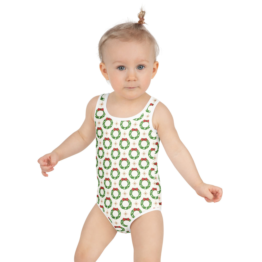 Girls christmas wreath buttery soft white one-piece swimsuit with green wreaths red bows and upf 50 plus protection