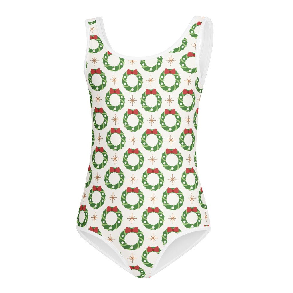 White girls christmas wreath buttery soft one-piece swimsuit with green wreaths red bows and gold starburst accents