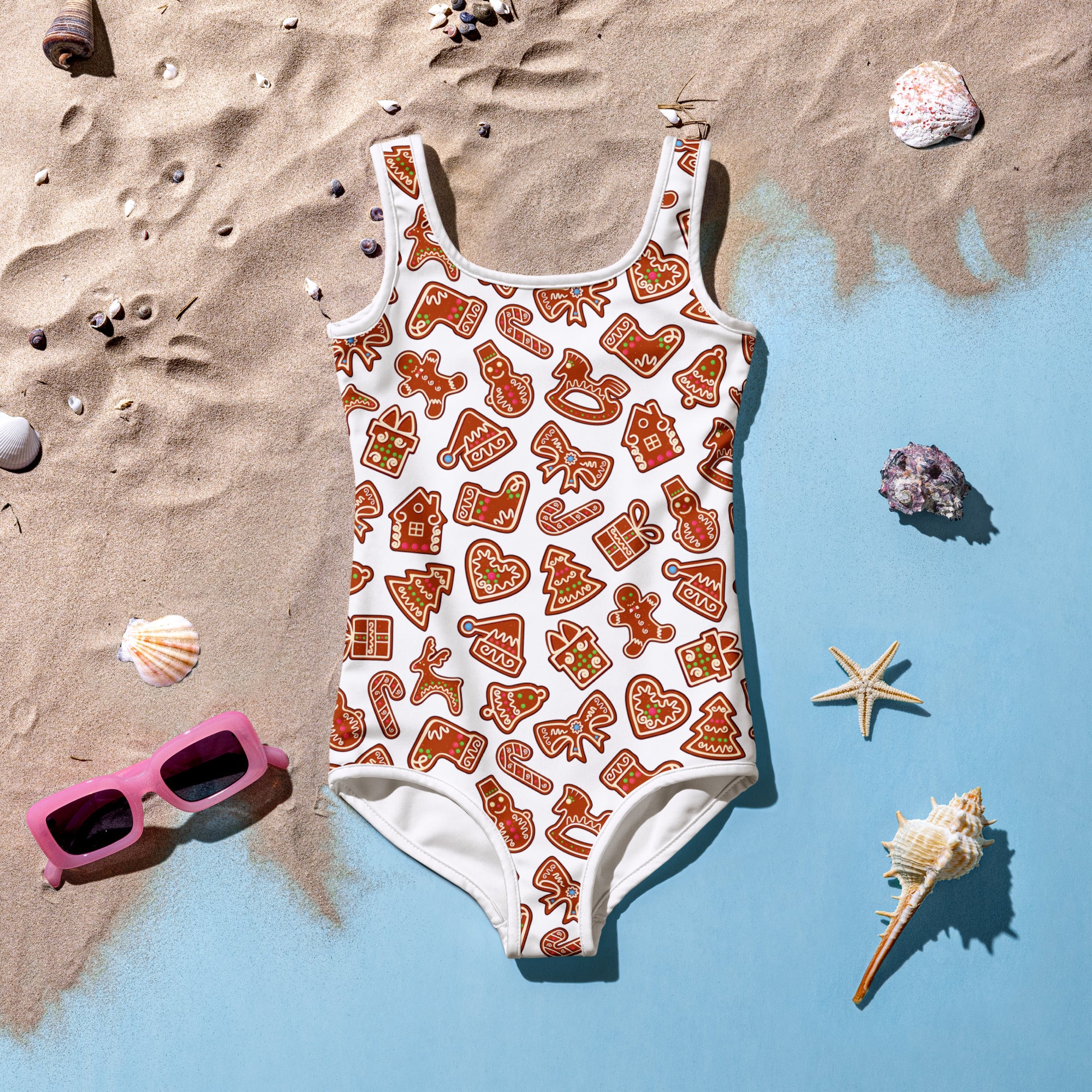 Girls gingerbread buttery soft white one-piece swimsuit with festive orange and brown holiday cookie pattern and UPF 50+