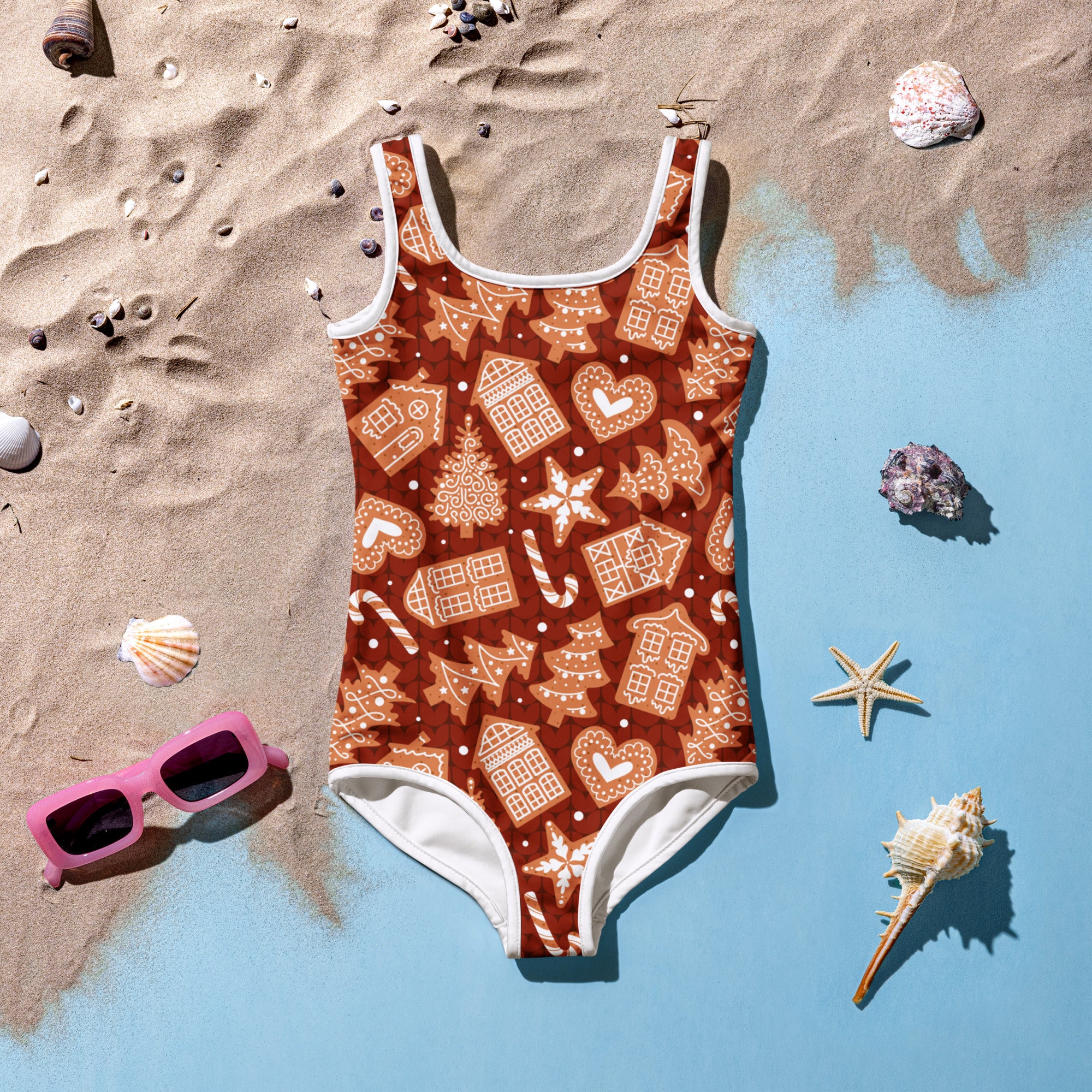 Girls red gingerbread cookie buttery soft one-piece swimsuit with gingerbread house candy cane star pattern and UPF 50+ protection