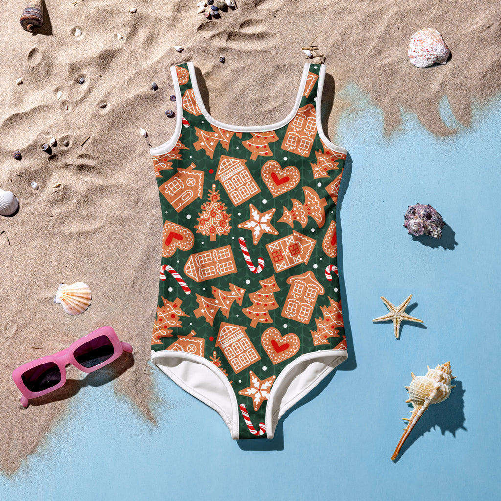 Girls green gingerbread cookie buttery soft one-piece swimsuit with gingerbread house pattern and UPF 50 plus protection