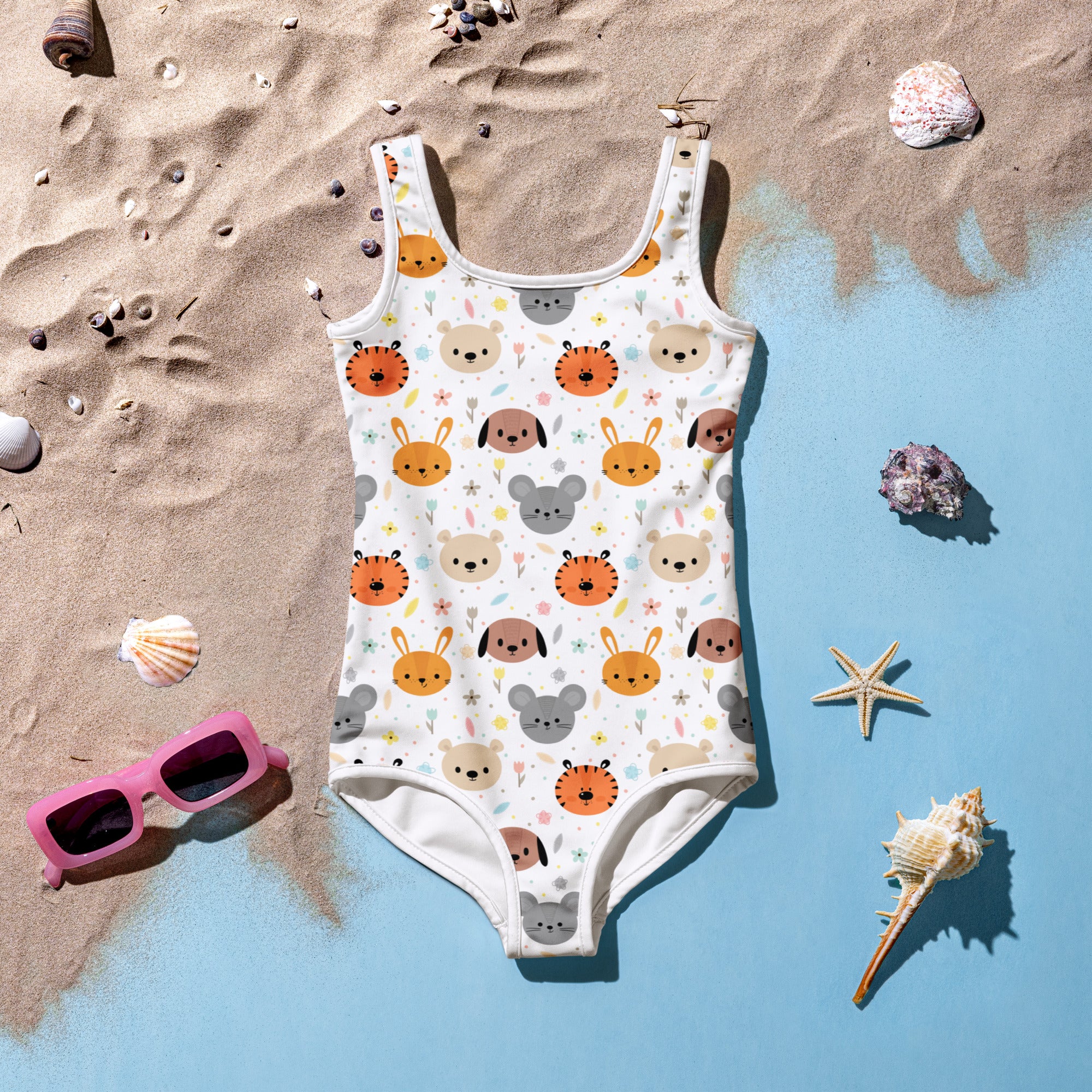 White girls one-piece swimsuit with playful orange gray and beige cartoon animals and buttery soft fabric with upf 50+ protection