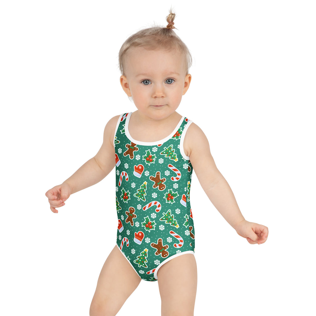 Girls green christmas cookie buttery soft one-piece swimsuit with white trim and festive gingerbread patterns