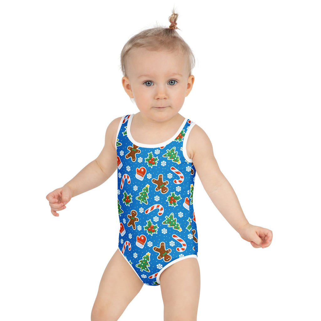 Girls blue christmas cookie buttery soft swimsuit with upf 50 plus white trim and festive gingerbread patterns