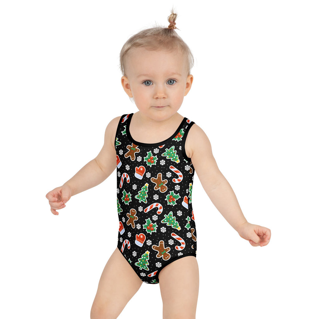 Girls black one-piece swimsuit with festive Christmas cookie graphics and buttery soft fabric with UPF 50 plus protection