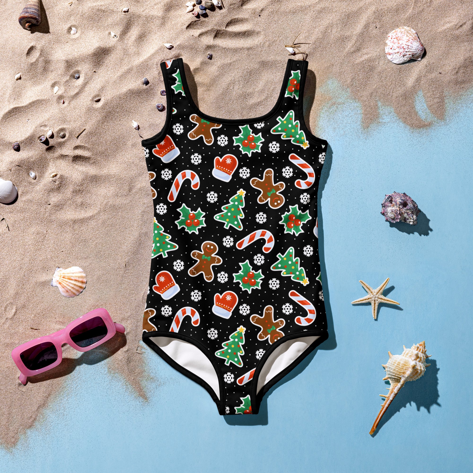 Girls black one-piece christmas cookie swimsuit with festive print and UPF 50+ buttery soft fabric