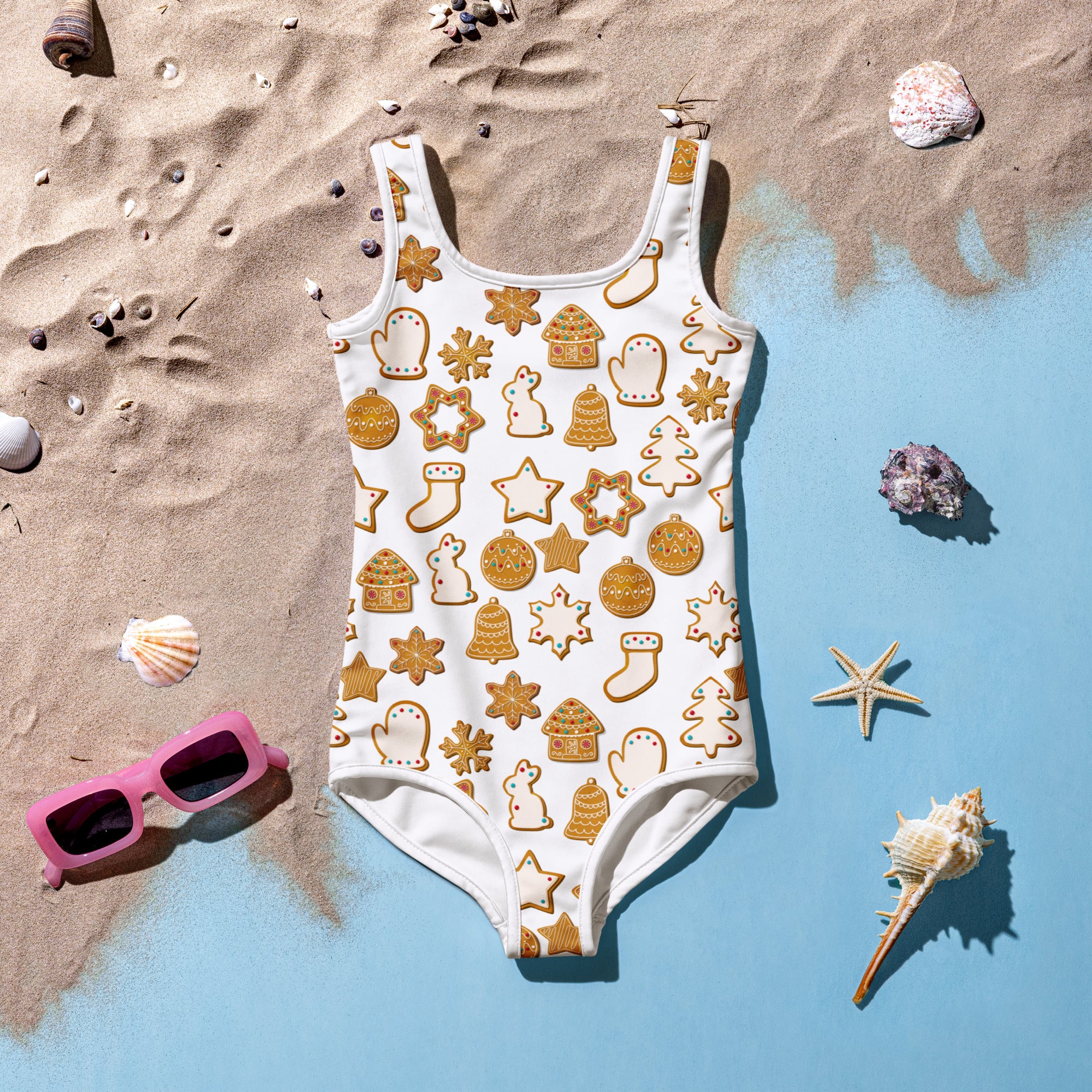 Girls white one-piece swimsuit with golden brown gingerbread cookie pattern buttery soft fabric and UPF 50+ protection