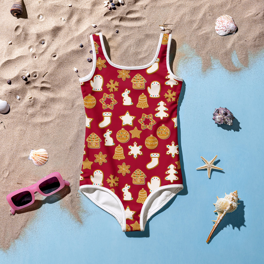 Girls red one-piece swimsuit with white trim and festive gingerbread cookies pattern made of buttery soft fabric with UPF 50+