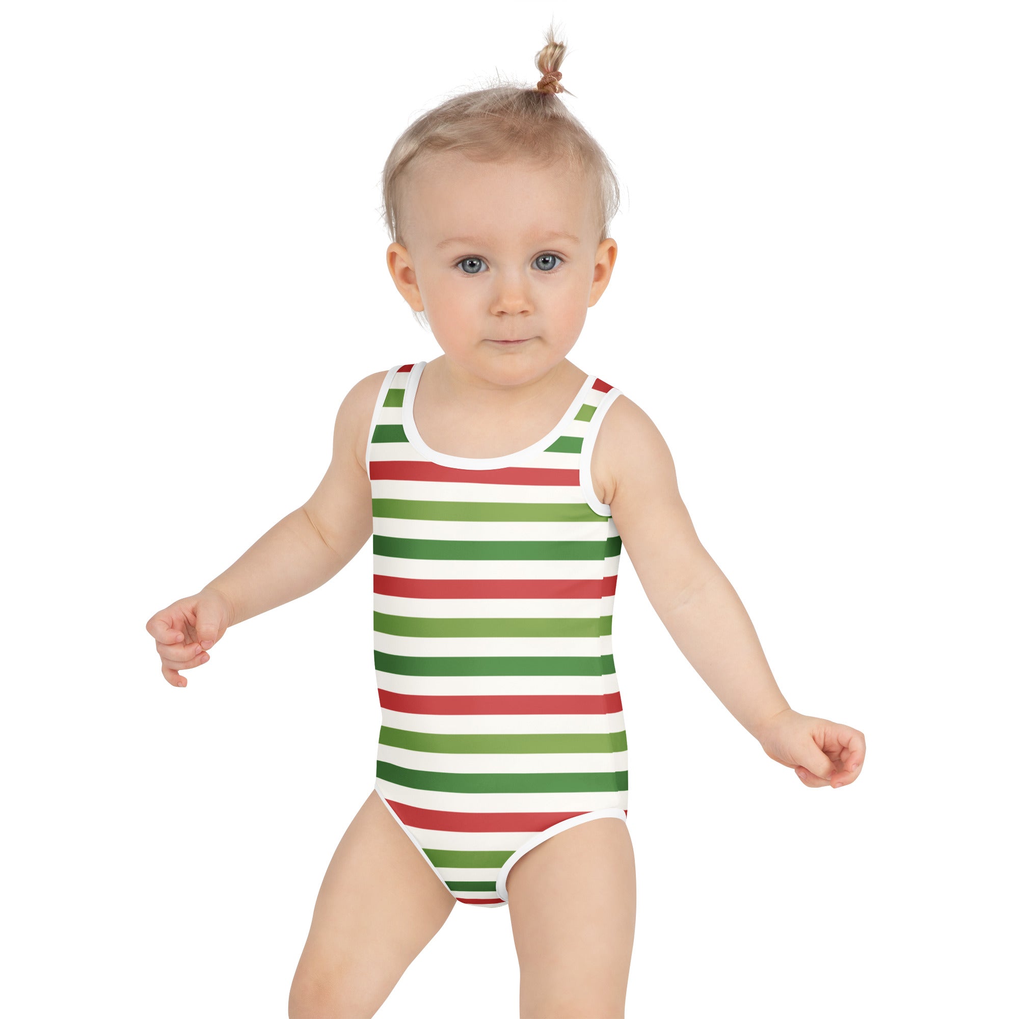 A toddler wearing a girls striped Christmas buttery soft swimsuit with UPF 50 plus in red and green horizontal stripes