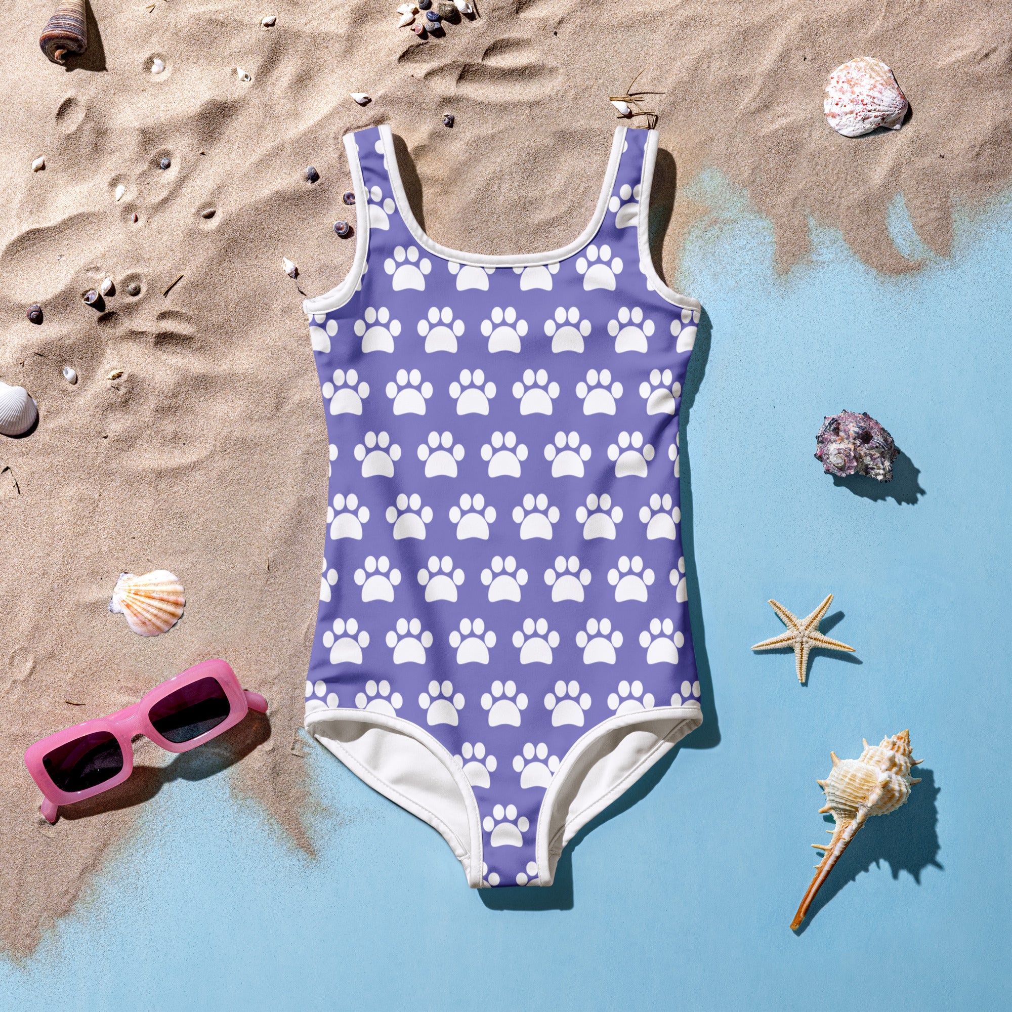 Girls purple one-piece swimsuit with white paw print pattern white trim buttery soft fabric and UPF 50+ protection