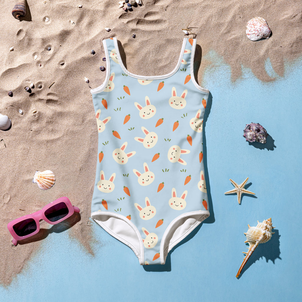 Girls bunny and carrot buttery soft swimsuit in light blue with playful pattern and white trim featuring UPF 50+ protection