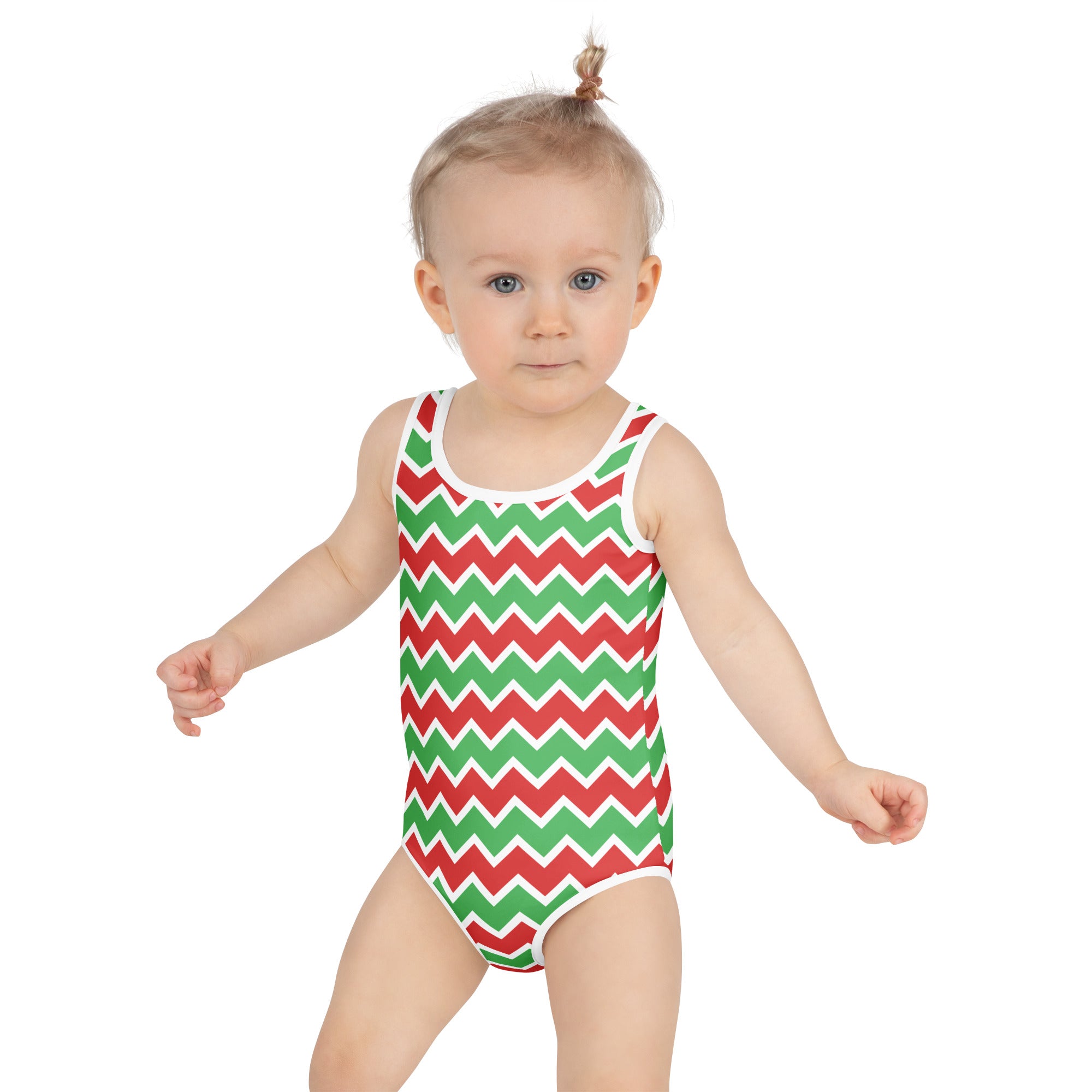 A toddler wearing a girls chevron christmas buttery soft red and green swimsuit with white trim and upf 50 plus protection