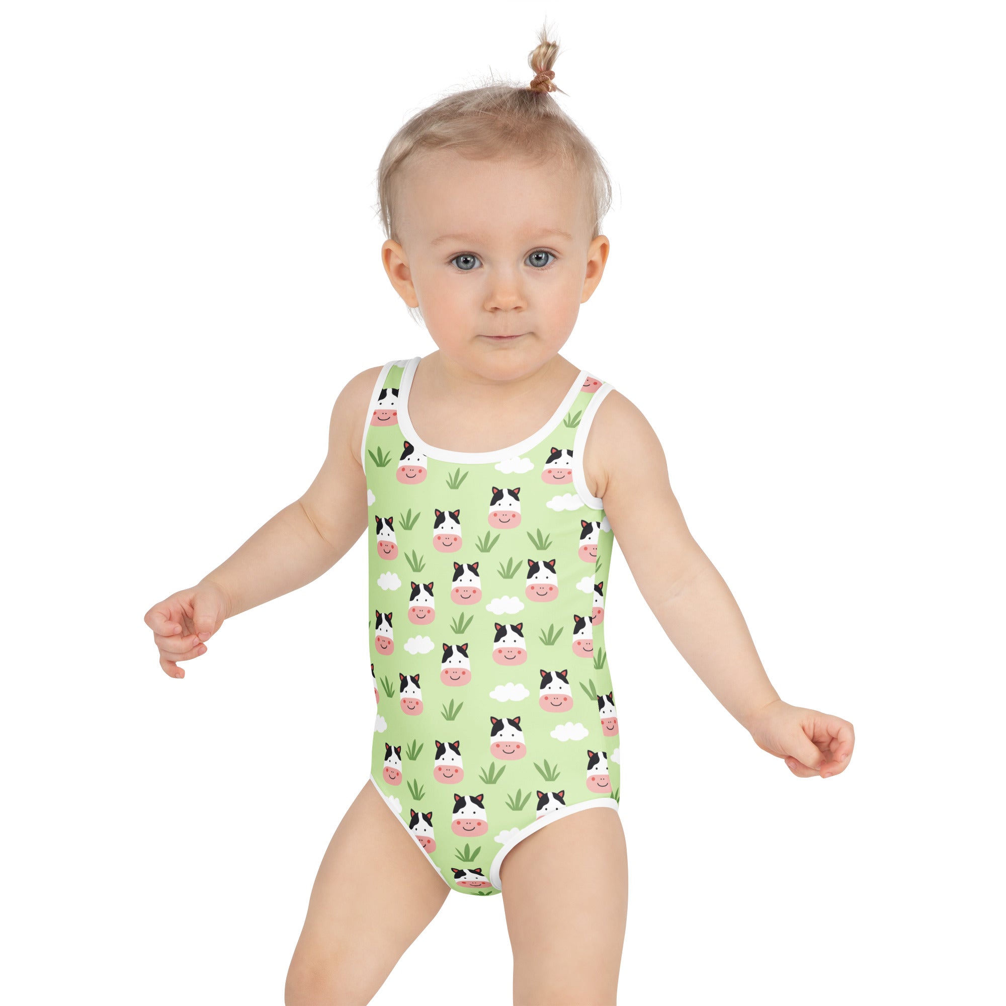 Girls green one-piece swimsuit with smiling cow print pink noses clouds buttery soft fabric upf 50 plus protection