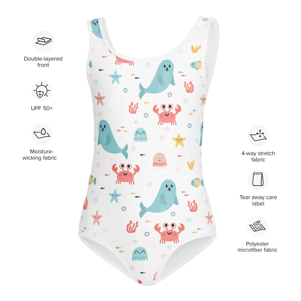 White one-piece girls sea animal swimsuit with playful blue seals and pink crabs on buttery soft microfiber fabric