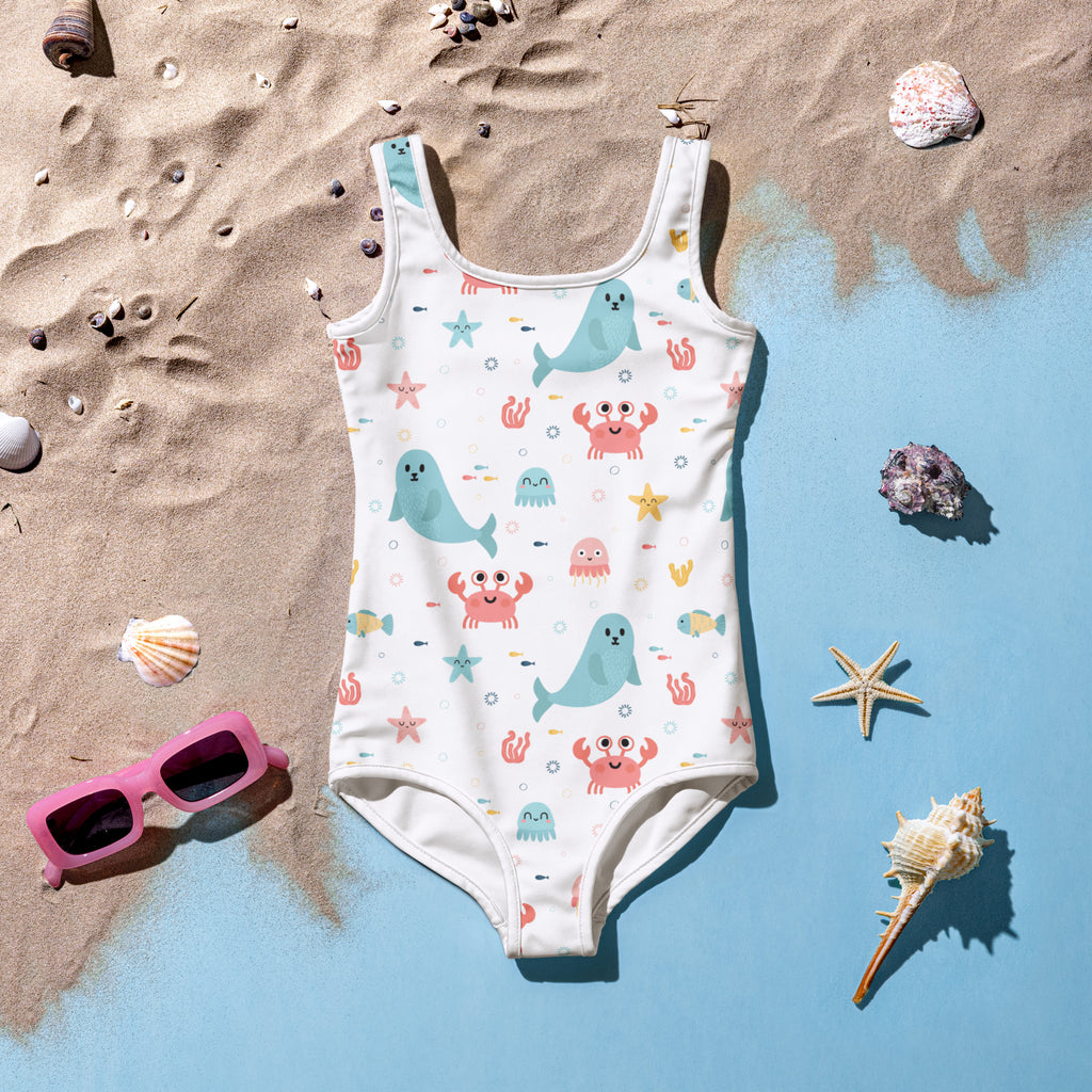 White girls sea animal buttery soft swimsuit with upf 50 plus featuring light blue whales pink crabs and starfish pattern