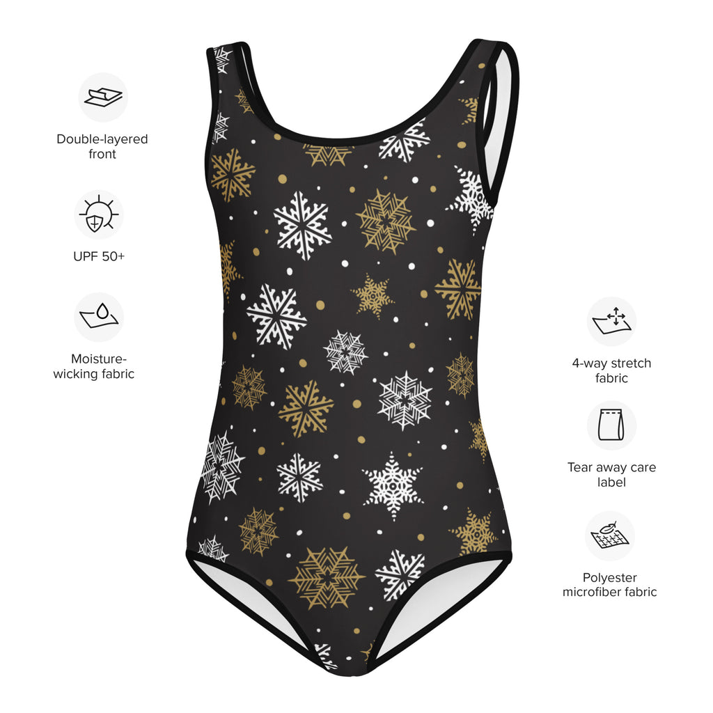 Black one-piece swimsuit with white and gold snowflake pattern made from moisture-wicking polyester microfiber fabric