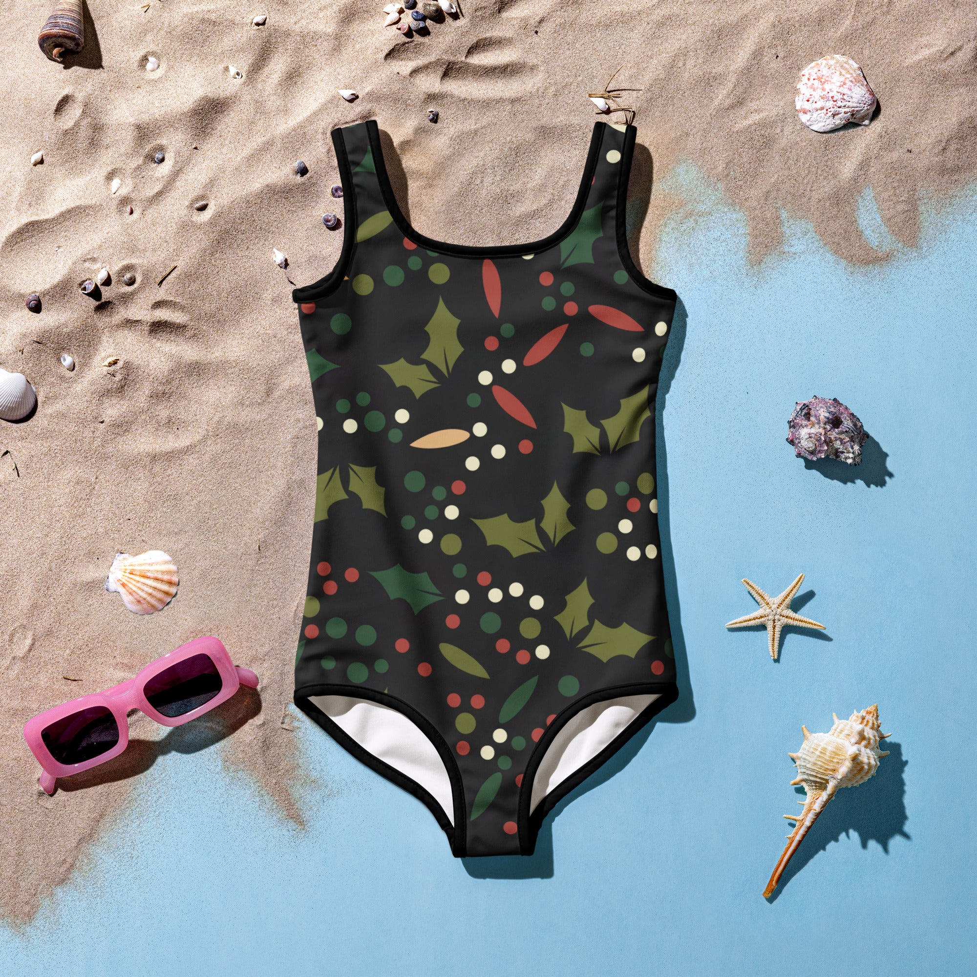 Girls holly berry christmas buttery soft black one-piece swimsuit with green holly leaves and UPF 50 plus protection