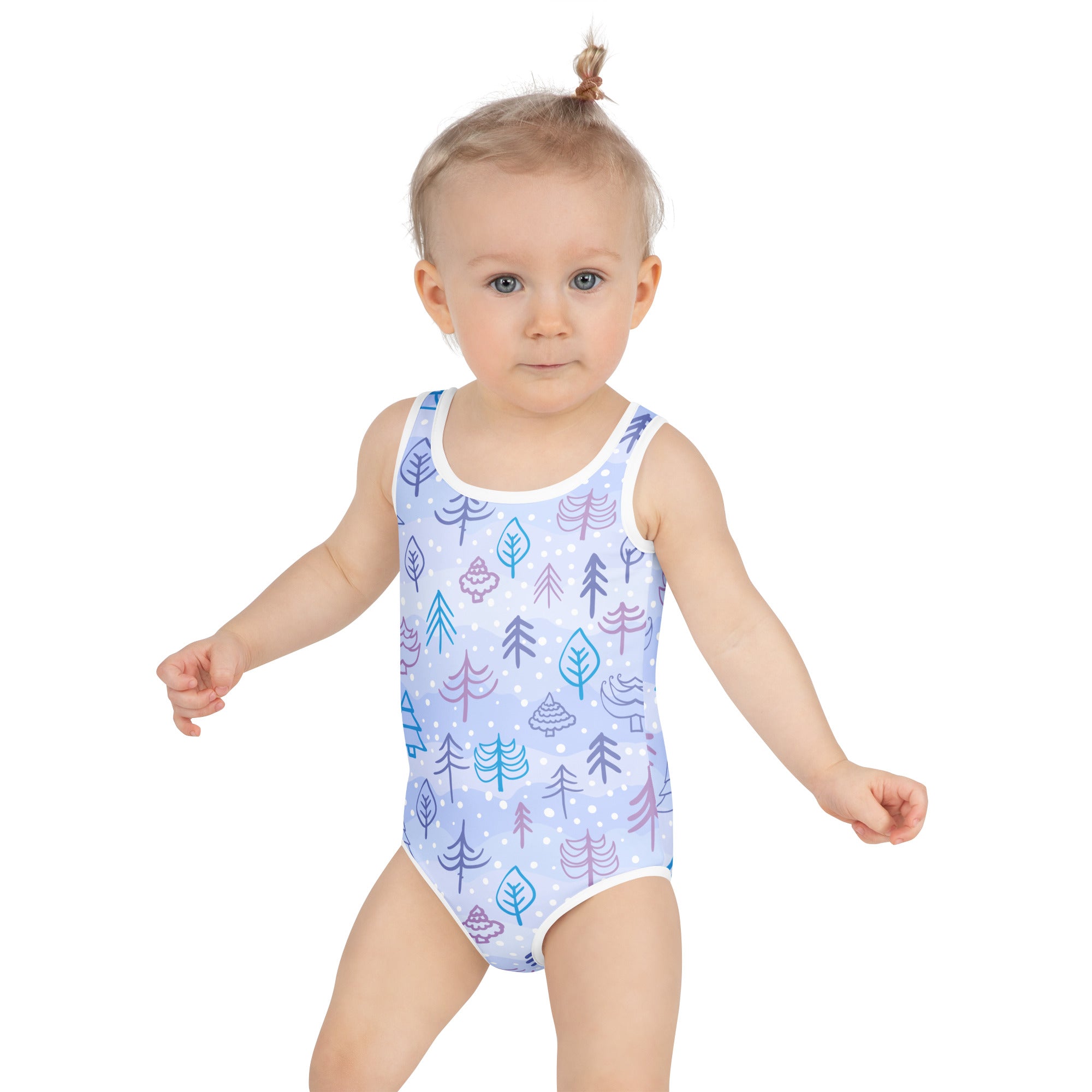 A light blue girls winter forest buttery soft one-piece swimsuit with teal purple tree pattern and UPF 50 plus protection