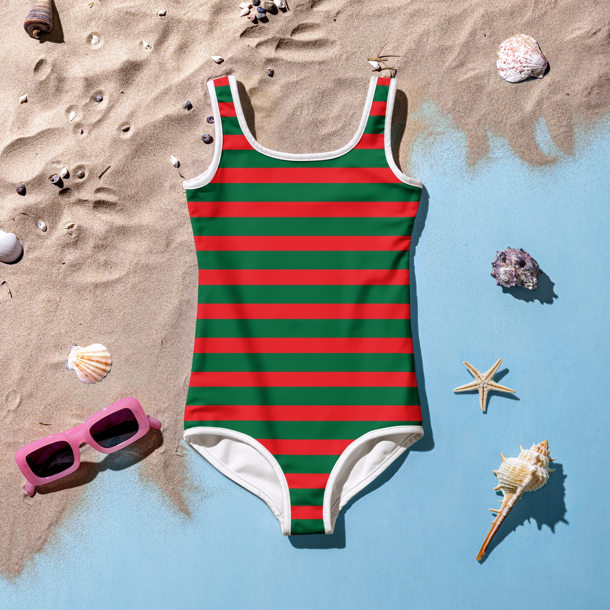 A girls festive christmas stripes buttery soft one-piece swimsuit in vibrant red and green with white trim and upf 50+