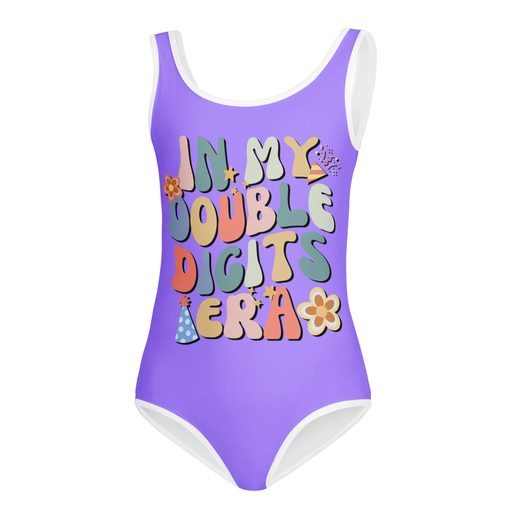 Purple girls one-piece leotard with white trim and colorful in my double digits era graphic for dance and gymnastics