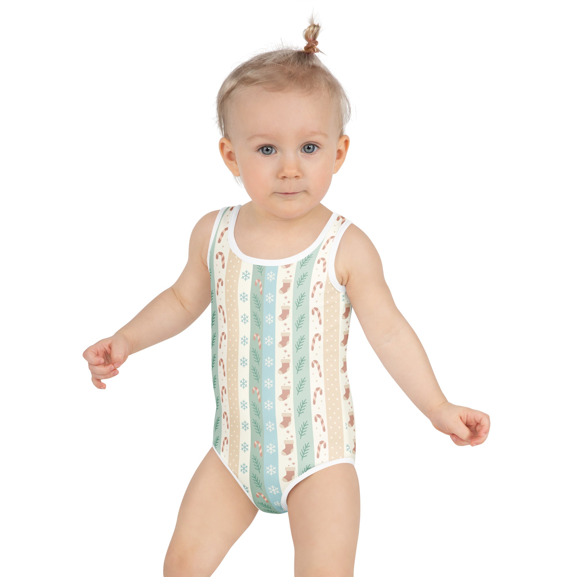 A toddler wearing a girls pastel christmas stripe buttery soft sleeveless swimsuit with mint green and cream candy cane print