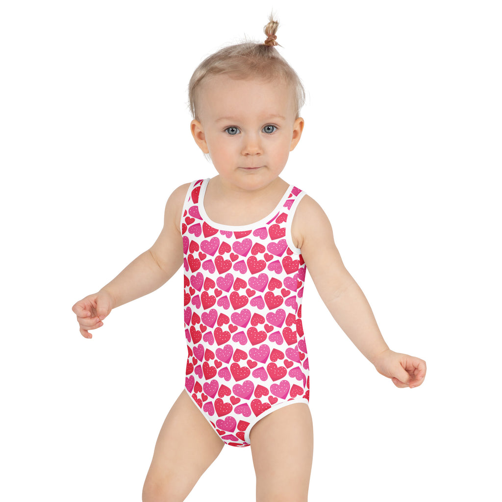 Girls pink hearts buttery soft swimsuit with double layered front and upf 50 plus in pink and white heart pattern