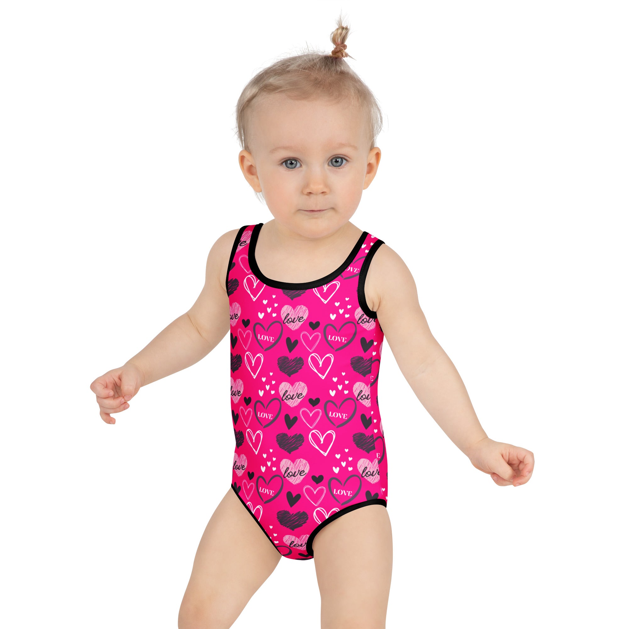 Girls valentine’s day pink heart buttery soft swimsuit with black trim and upf 50 plus double layered front