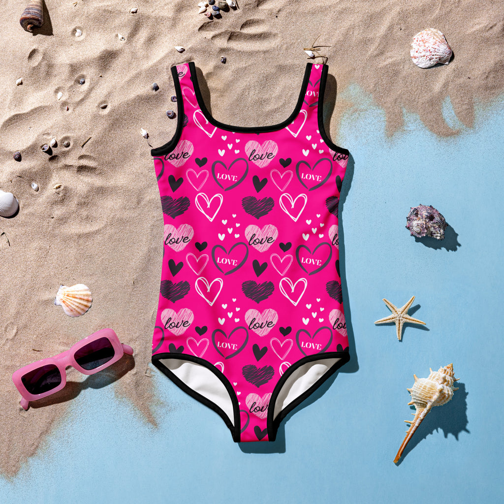 Girls Valentine’s Day pink heart buttery soft swimsuit with black white heart pattern love print and UPF 50+ protection