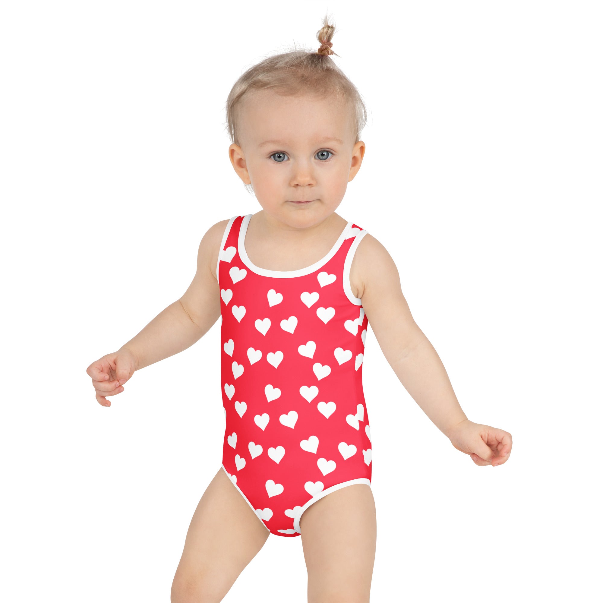 Girls red one-piece swimsuit with white heart pattern and trim made of buttery soft fabric with UPF 50 plus protection