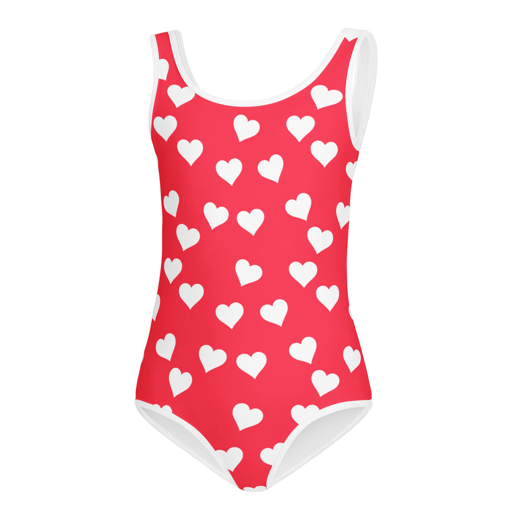 Girls bright pink butter soft leotard with white heart pattern and trim for quick drying dance and gymnastics use
