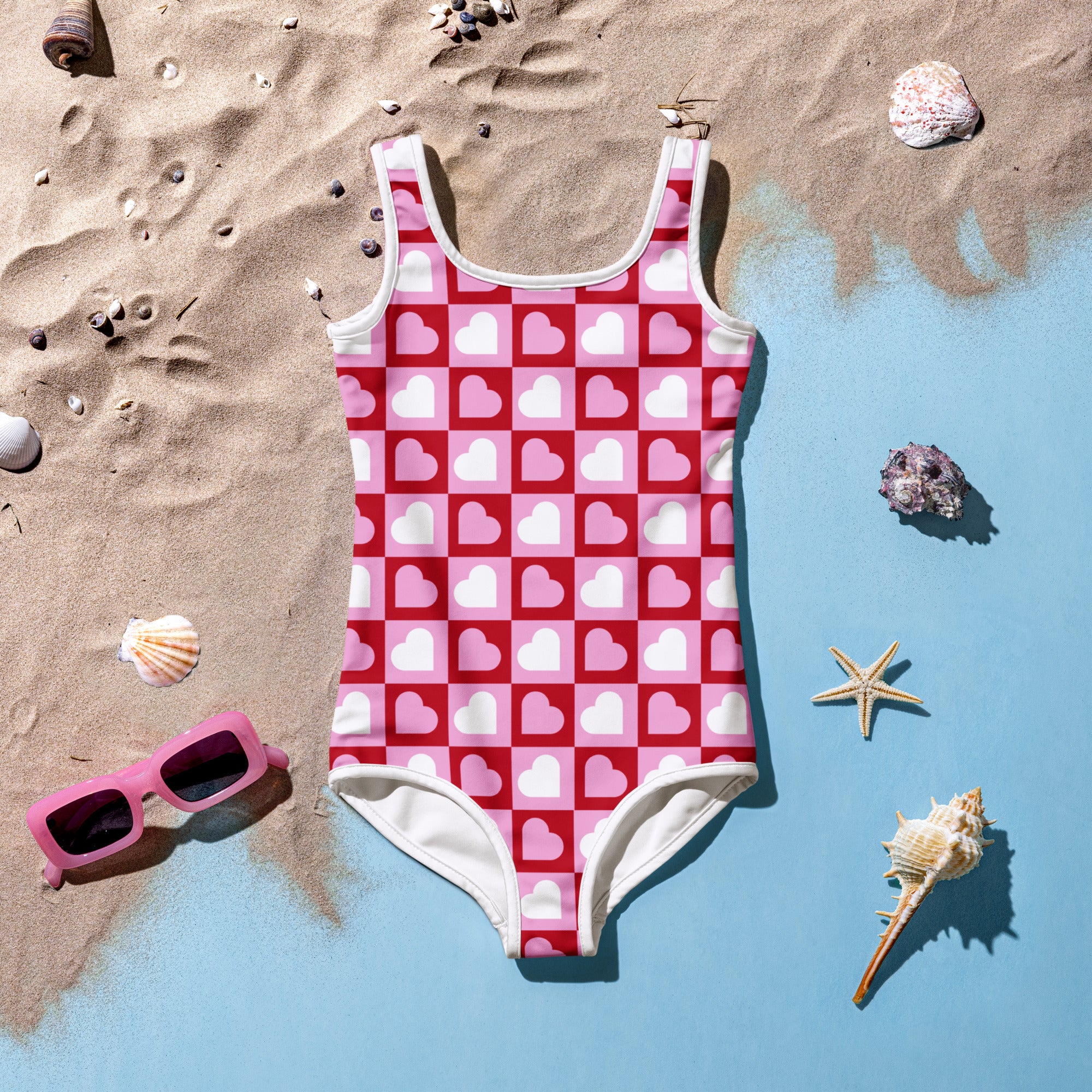 Girls pink heart squares checkerboard buttery soft one-piece swimsuit with white trim and UPF 50 plus protection