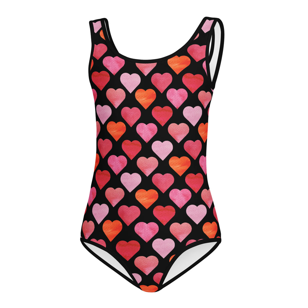 A black one-piece girls leotard with vibrant watercolor heart pattern in pink red and orange quick drying for dance and gymnastics