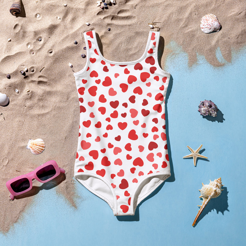 Girls red hearts buttery soft swimsuit in white with red heart pattern and upf 50 plus protection