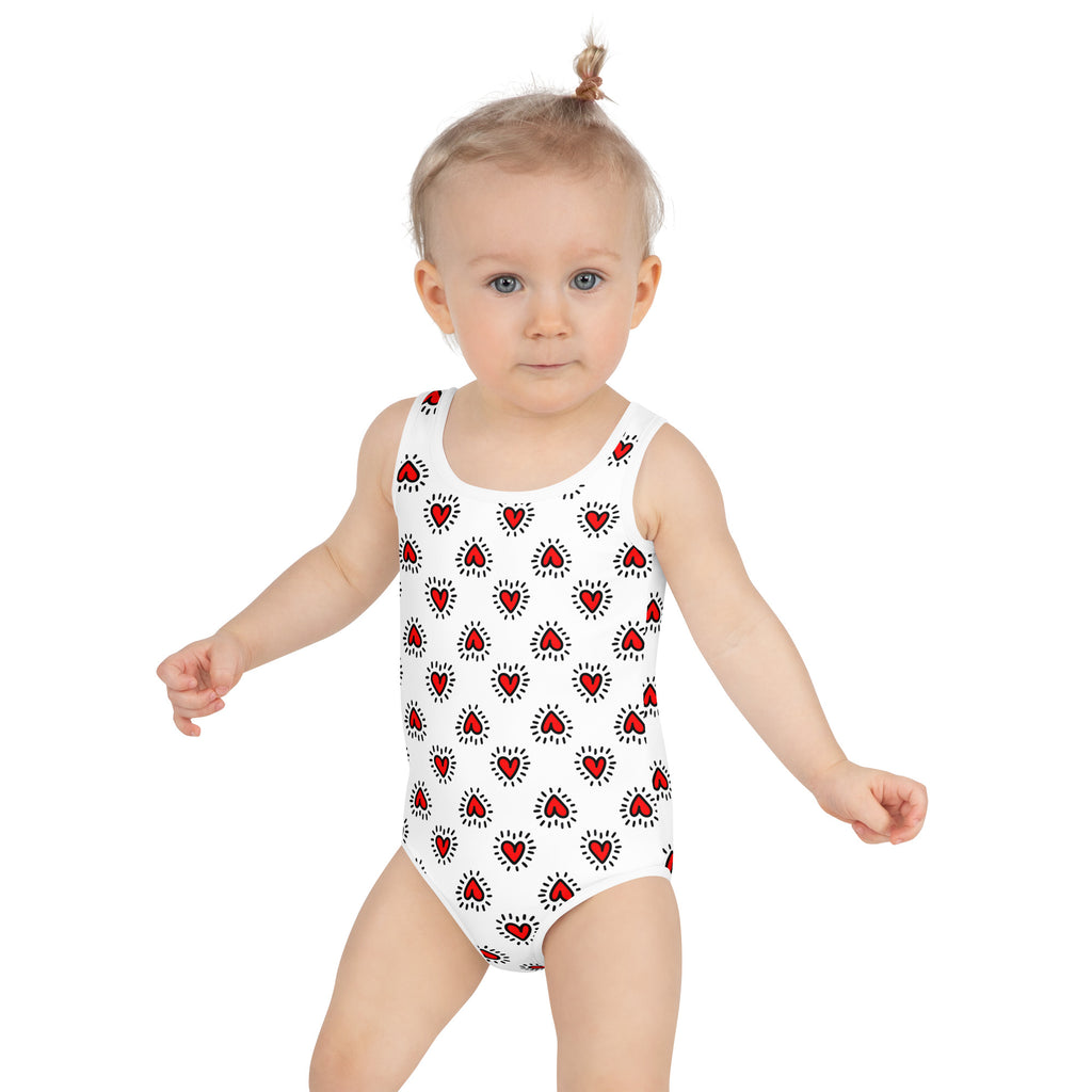 White girls one-piece swimsuit with red hearts and radiating lines buttery soft upf 50 plus double layered front