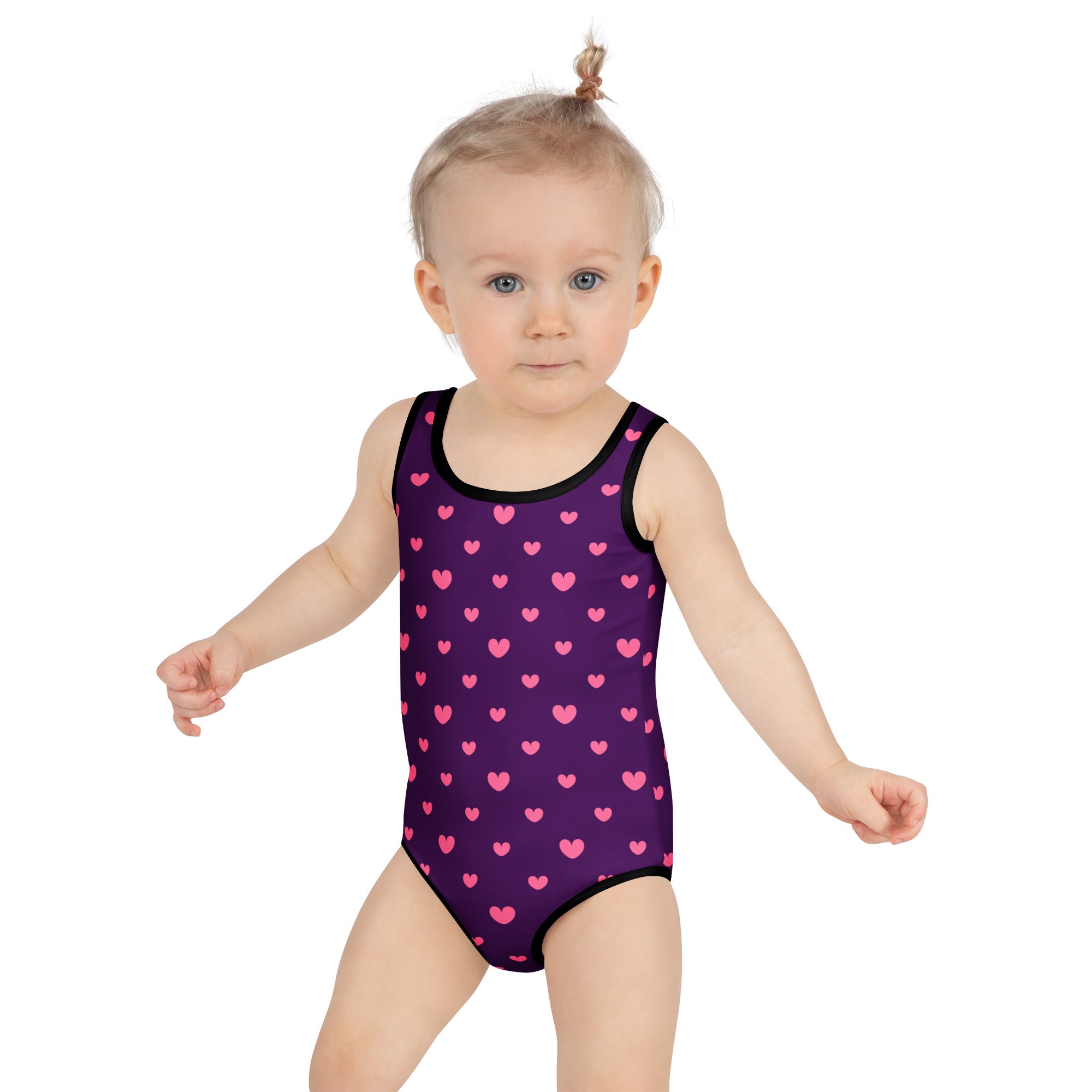 Girls purple valentines day buttery soft one-piece swimsuit with pink heart pattern black trim and upf 50+ protection