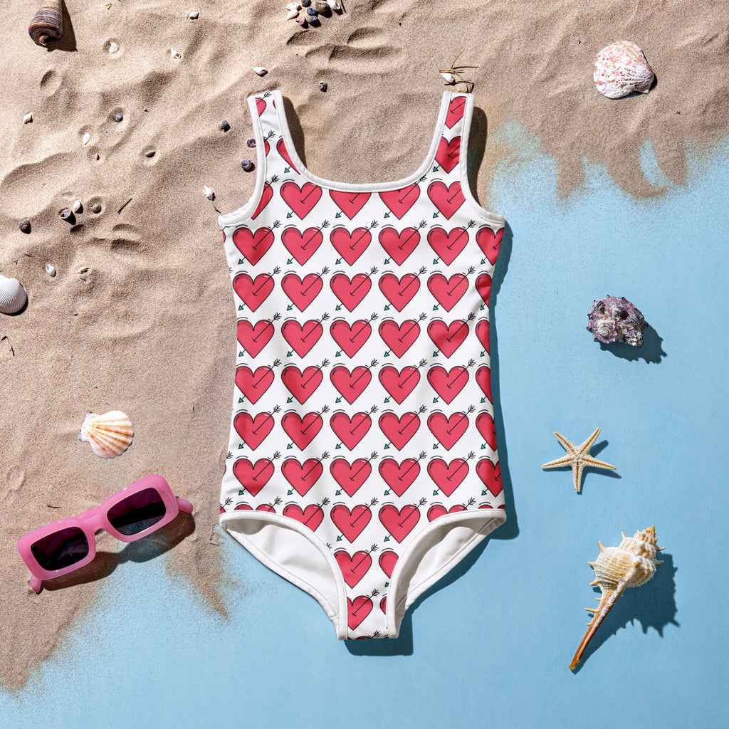 Girls arrow heart buttery soft swimsuit in white with red heart pattern and green stems featuring upf 50 plus protection