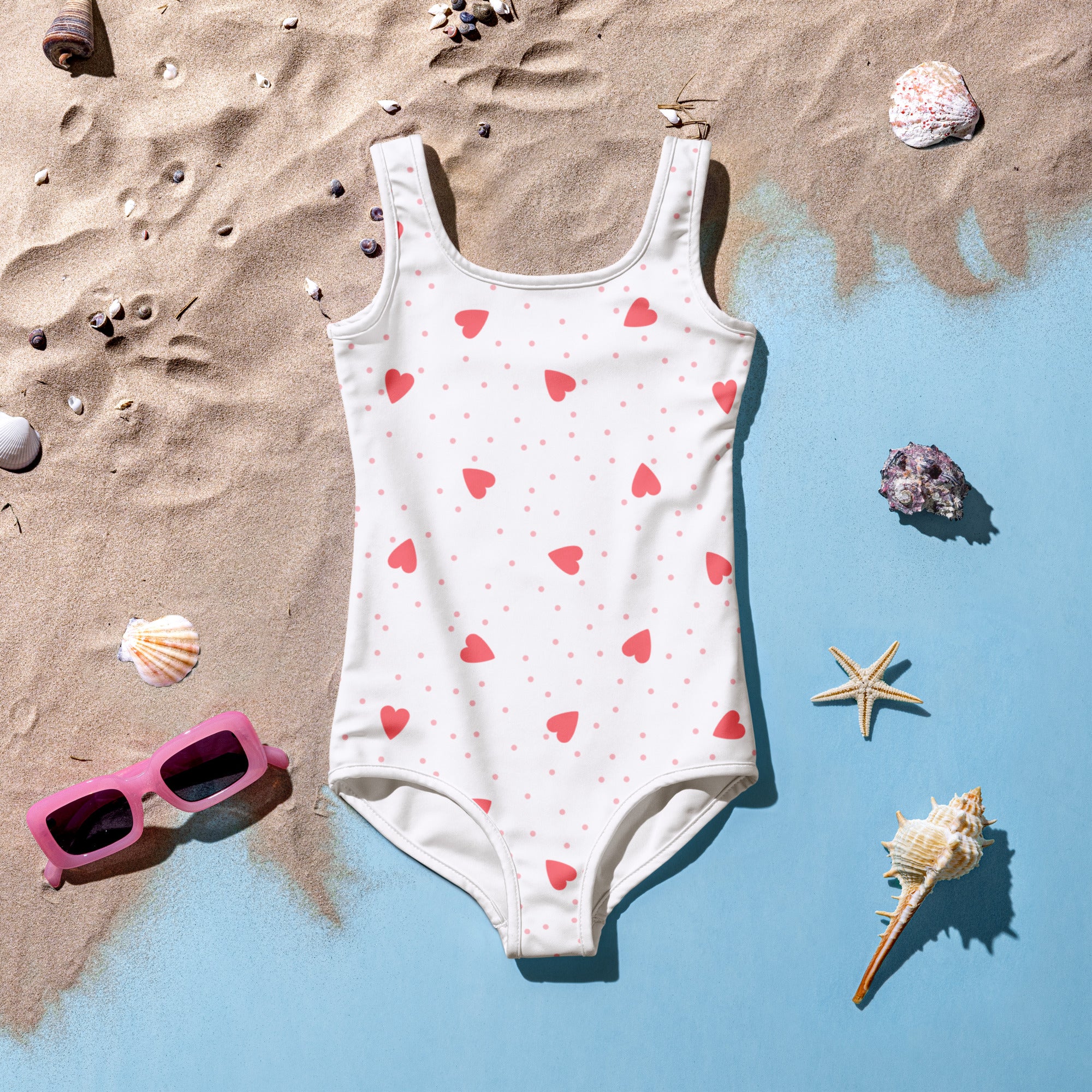 White one-piece girls swimsuit with pink heart and dot pattern buttery soft fabric and upf 50 plus protection