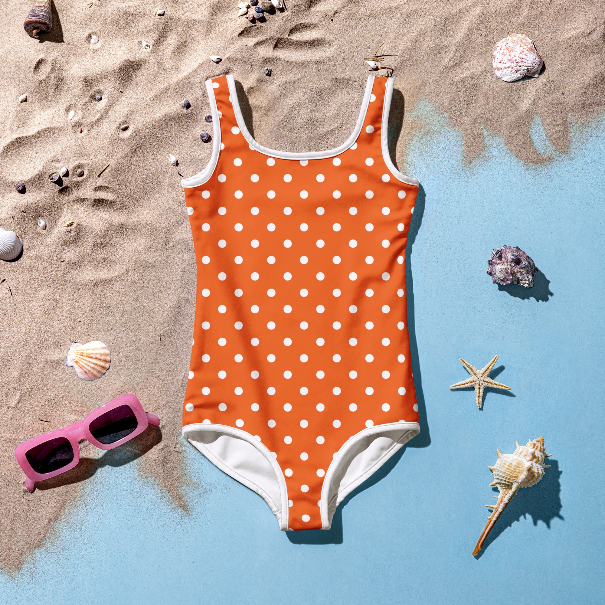 Girls orange polka dot buttery soft one-piece swimsuit with white trim and UPF 50 plus protection front view
