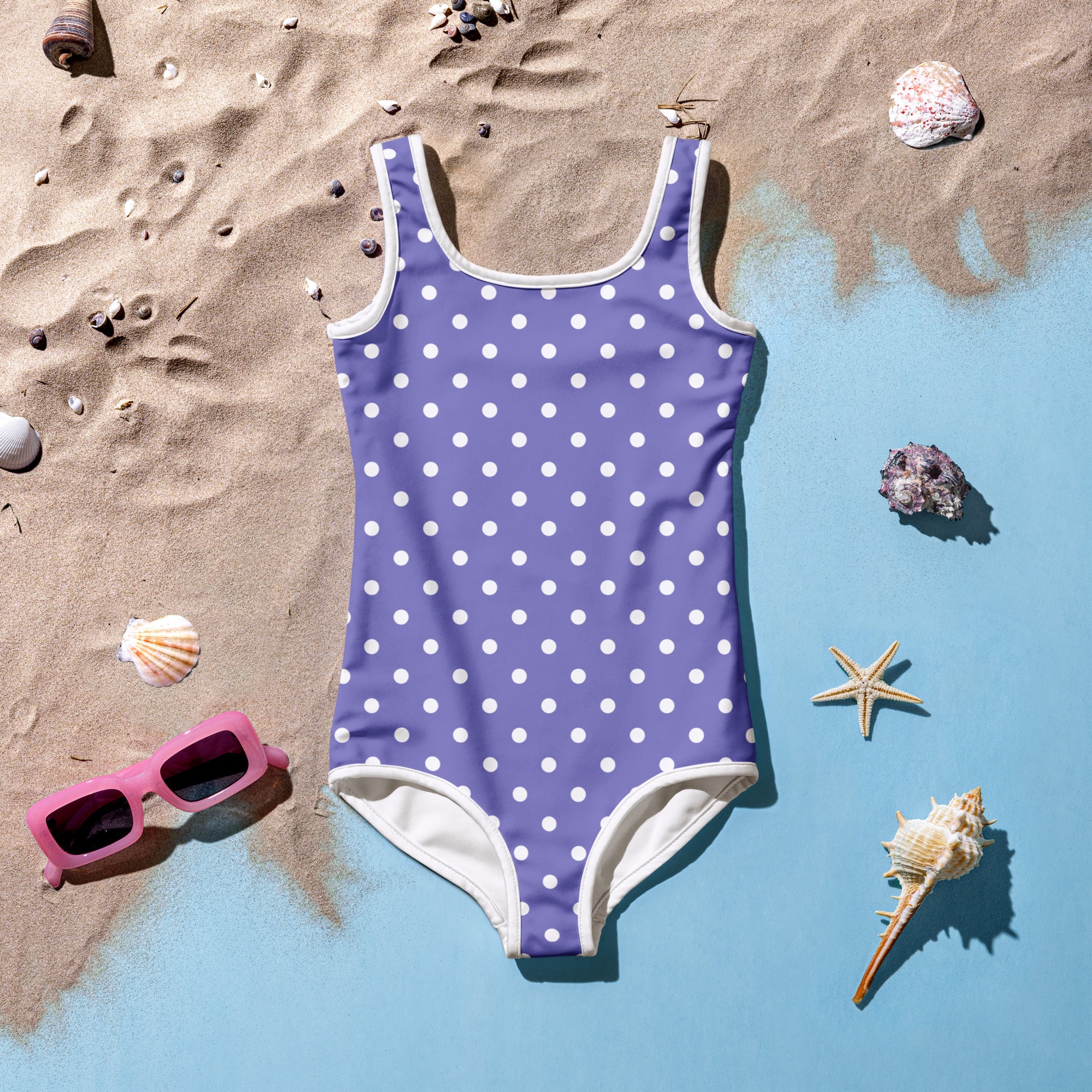 Girls purple polka dot buttery soft swimsuit with white trim and UPF 50 plus double layered front