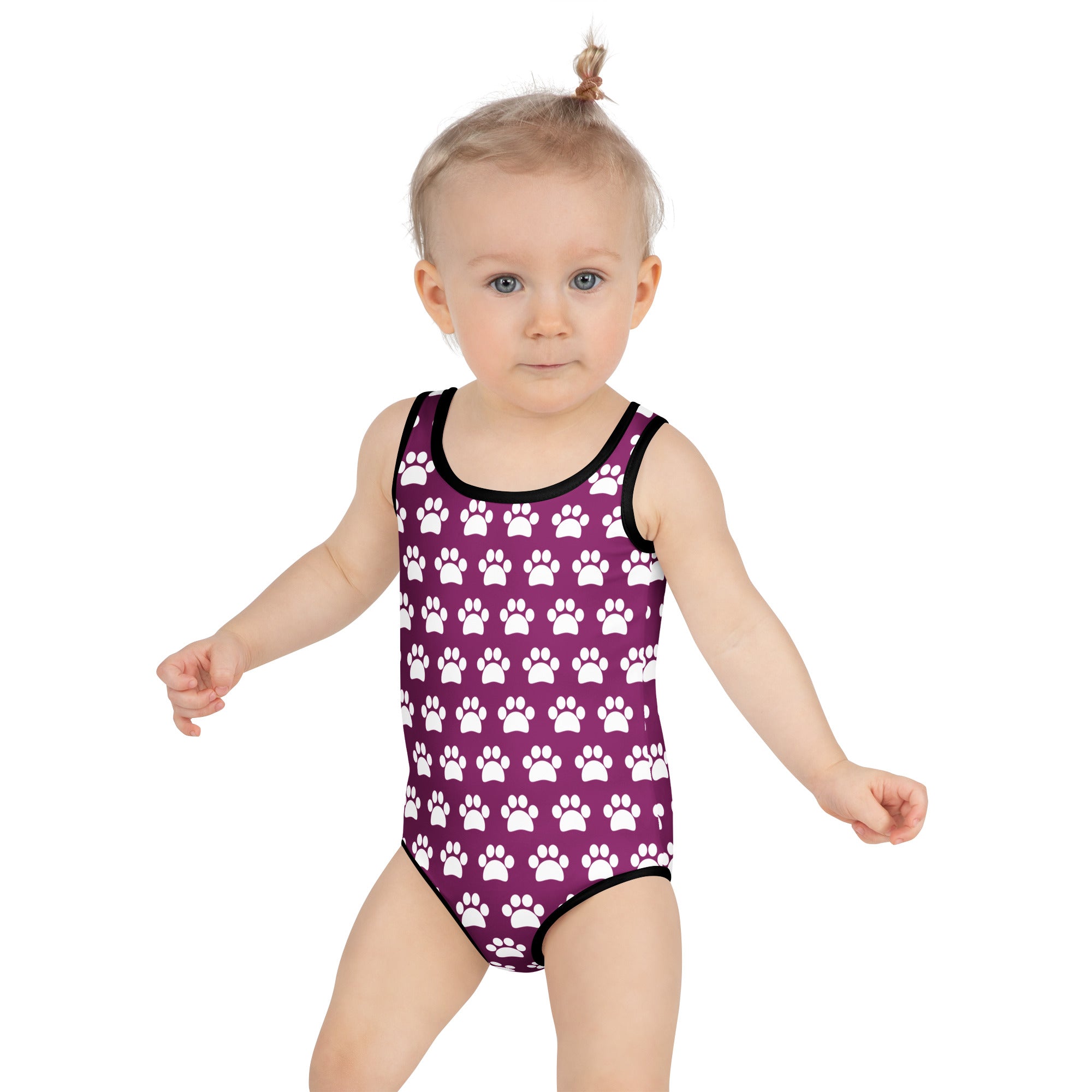 Girls purple one-piece swimsuit with white paw print pattern black trim buttery soft fabric and UPF 50 plus protection