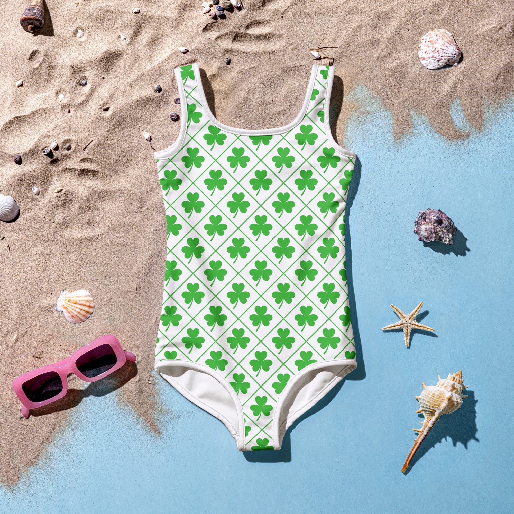 White girls one-piece swimsuit with vibrant green shamrocks on a grid design buttery soft fabric upf 50 plus