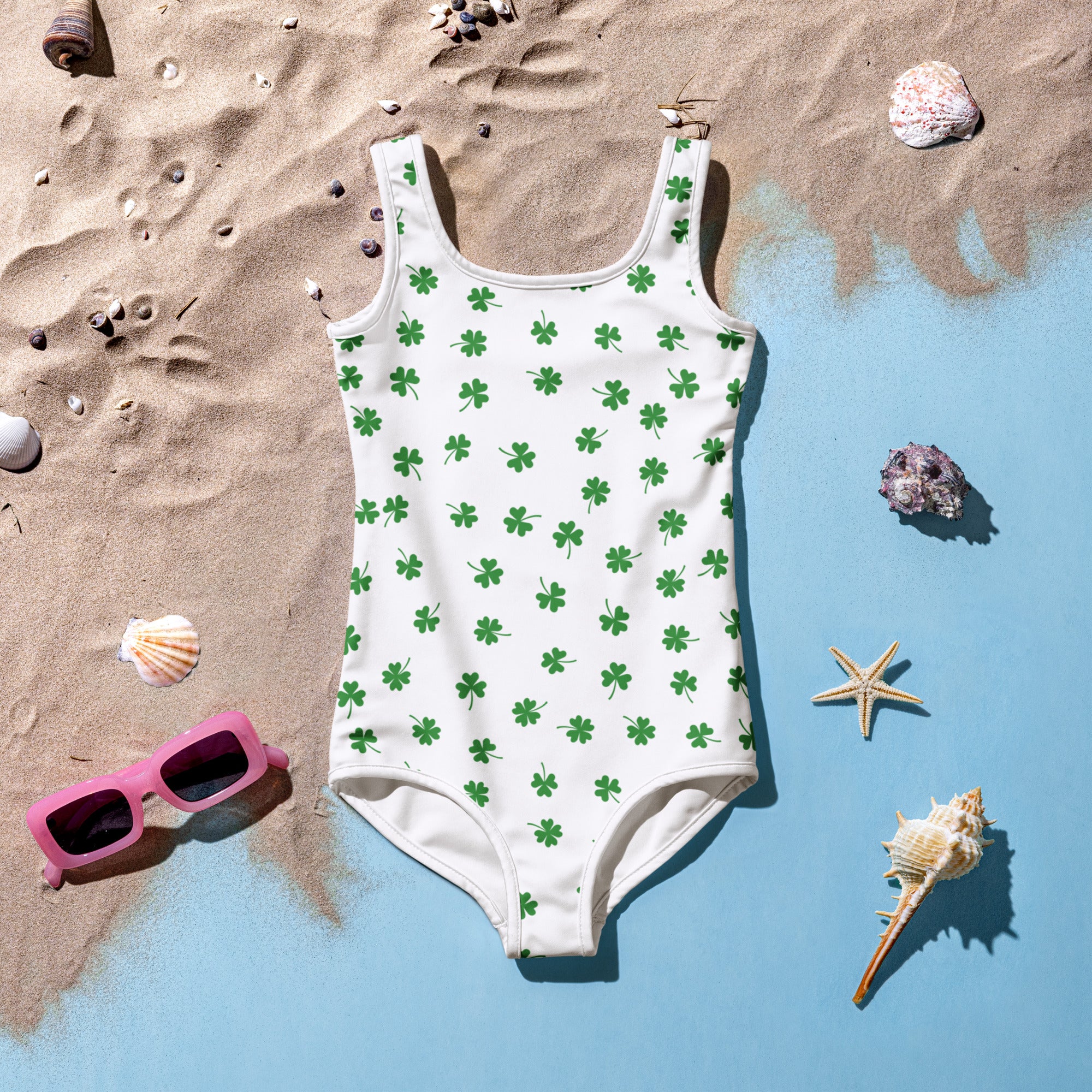Girls shamrock buttery soft white one-piece swimsuit with green four-leaf clovers and UPF 50 plus double layered front