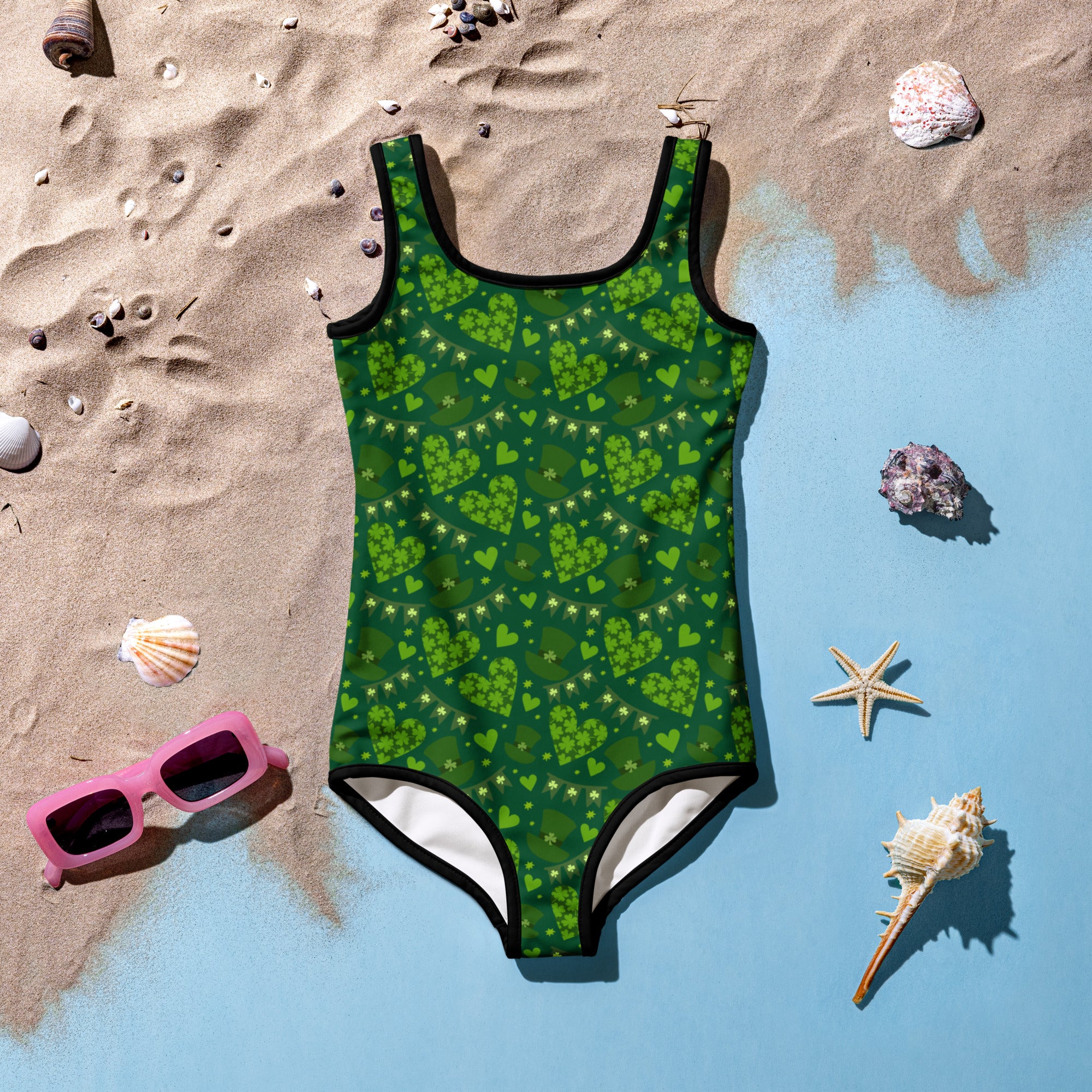 Girls green shamrock heart buttery soft swimsuit with black trim and UPF 50 plus double layered front protection