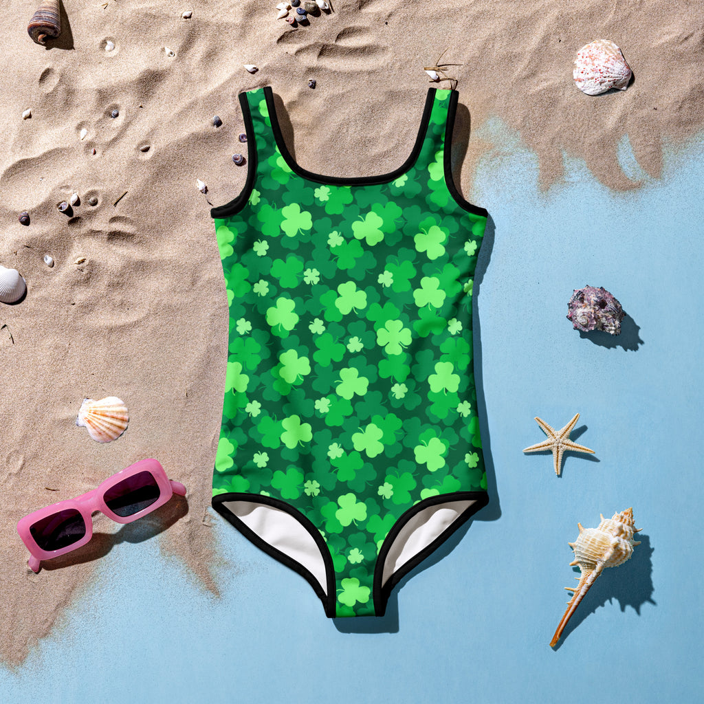 Girls green shamrock buttery soft swimsuit with black trim and upf 50 plus double layered front for sun protection