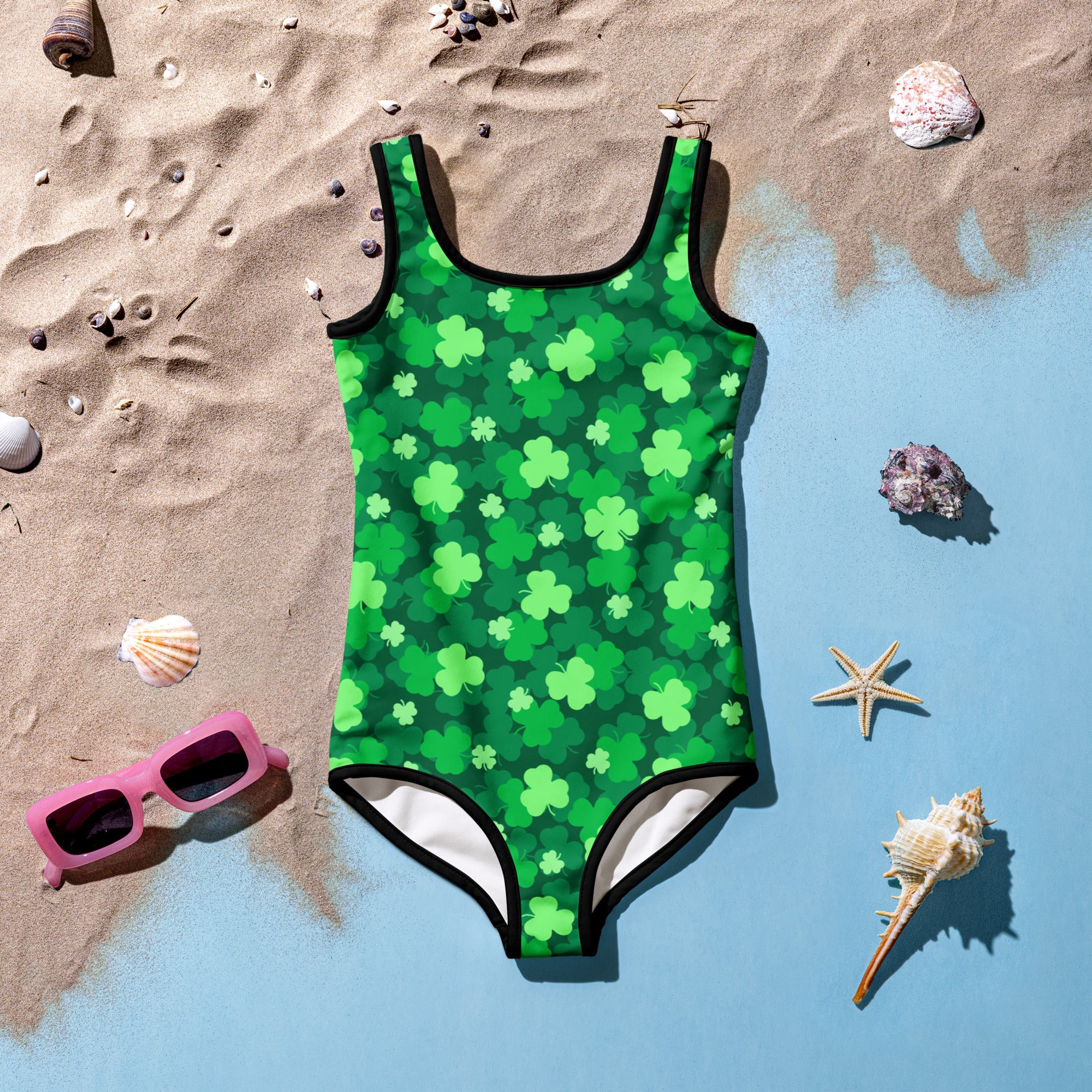 Girls green shamrock buttery soft swimsuit with black trim and upf 50 plus double layered front for sun protection