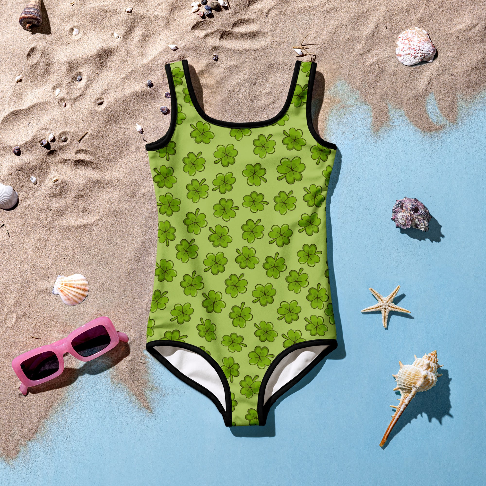 Girls clover buttery soft lime green one-piece swimsuit with clover pattern black trim and UPF 50 plus protection
